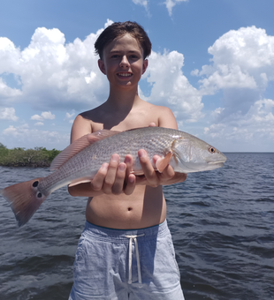 Reeling in the reds at Bayport Park with a mix of jigging and trolling!