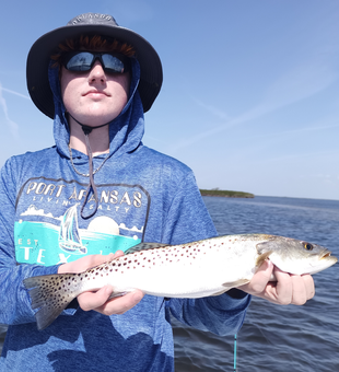 Reeled in a nice catch on a peaceful day by the water.