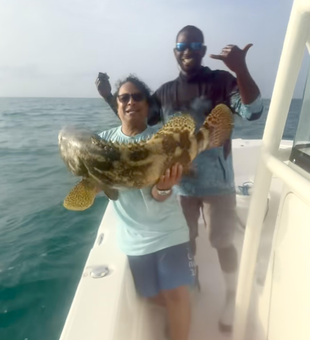 Reeling in a huge catch while deep sea fishing in the beautiful waters off Key Largo!