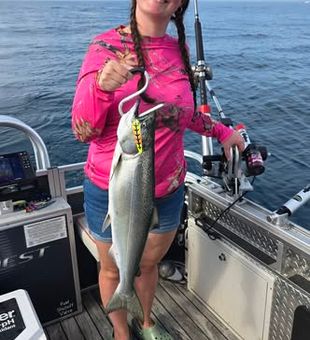 Share the excitement of landing fish together on a memorable Lake Michigan fishing trip.