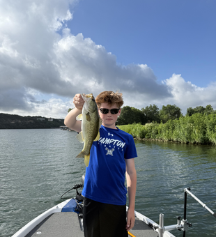 Reeling in a 19-inch Florida Bass at Buchanan Dam under partly cloudy skies!