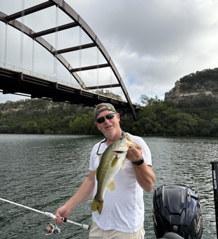 Reeling in a Florida Bass at Buchanan Dam - storms brewing, fish biting!