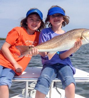 Girls With Their Redfish in Titusville, FL 