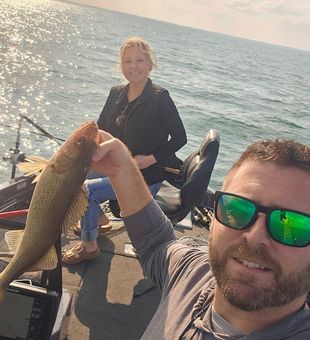Early morning walleye bite on Lake Erie out of Vermilion, Ohio. Calm water and steady action make for a great day on the lake.