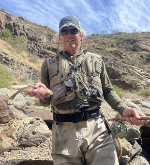 Nice catch in the canyon today! Fly fishing in rocky terrain can be exciting.