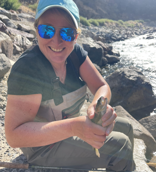 Nice catch using fly fishing on a partly cloudy day!