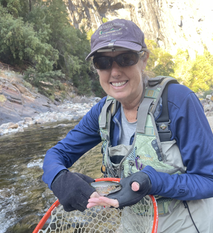 Nice rainbow trout on the fly! Partly cloudy conditions made for an exciting day on the water.