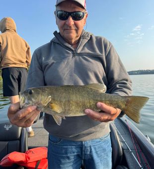 Hooking quality fish while freshwater fishing in Branson MO’s top lakes and rivers.