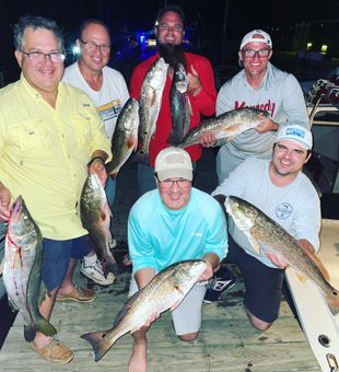 Group Redfish success on a fun New Smyrna Beach night!