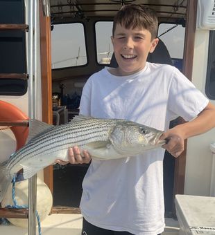 Proud moment with a solid striped bass