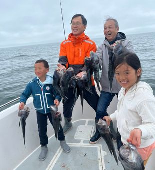 Great Cape Cod seabass action for this happy family.
