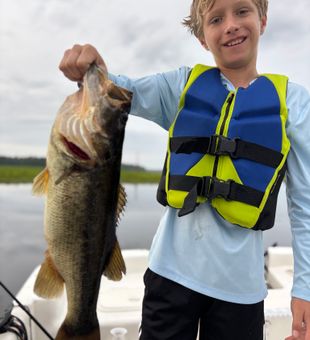 Young angler lands a big largemouth bass!