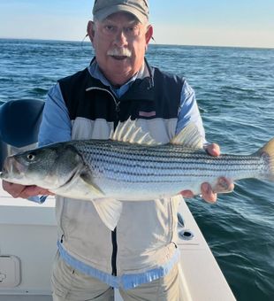 Proud striped bass catch on the bay.