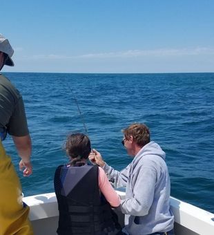 Learning the ropes on a Narragansett Bay fishing trip.
