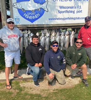 Smiles all around after a successful Lake Michigan outing.