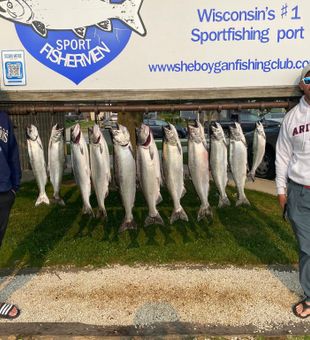 Anglers landing Salmon on Lake Michigan