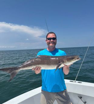 Proud angler with a big Cobia catch