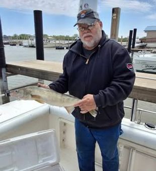 Experience the thrill of fishing Lake Erie’s wide waters from Port Clinton, surrounded by endless horizon and fresh lake air
