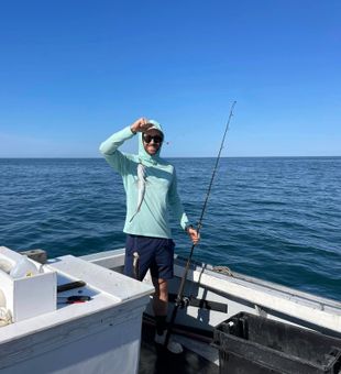 Man smiling with his prized catch.