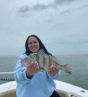 Reeling in a Black Drum on a partly cloudy day in Savannah!