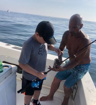 Focused tautog catch aboard New Jersey fishing