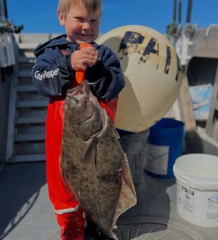 Baby with a Flounder Wonder - Larsen Bay, AK.