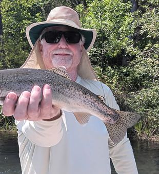 Strong rainbow trout on a fly trip