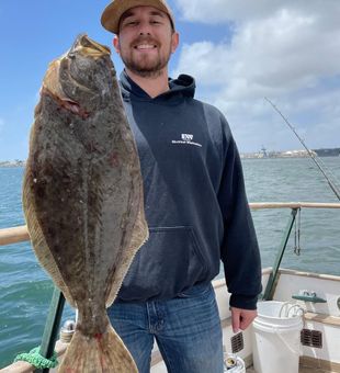 Proud angler with a chunky Halibut