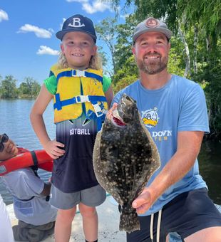Smiles and fish—perfect day on the river.