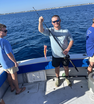Orange fish caught on Palm Beach fishing adventure!