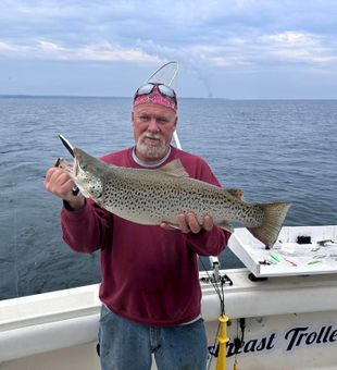 Reeling in joy on Ontario's waves.