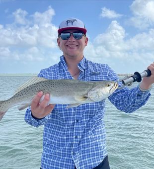 Exciting catch of a big South Padre Island speckled trout.
