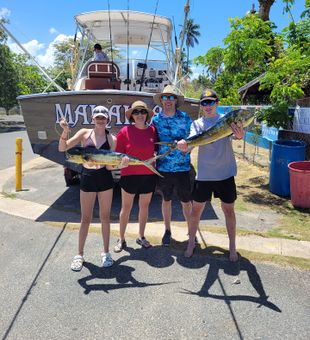 Family bonding fishing mahi-mahi