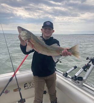Early morning bites in Ludington, MI delivering nonstop walleye action and powerful salmon runs.