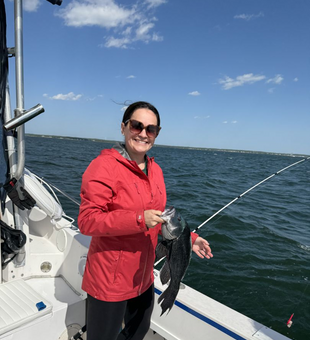 Happy angler with a beautiful Black Sea Bass.