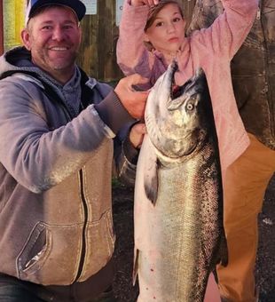 Proud family with giant Chinook Salmon!