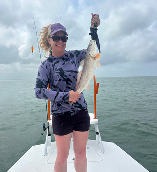 Reeling in the big one on a cloudy day at South Padre Island!