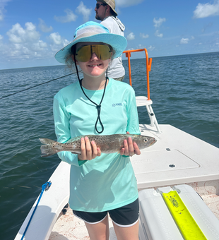 Reeled in a huge spotted weakfish on a South Padre Island fishing adventure!
