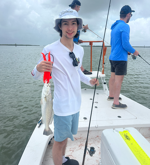 Just landed a feisty Spotted Weakfish on a day with strong storms in the forecast!