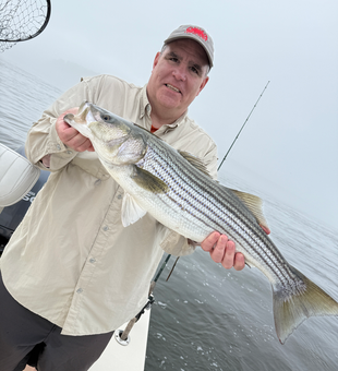 Striped bass caught at the picturesque Portsmouth Marina on a partly cloudy day.