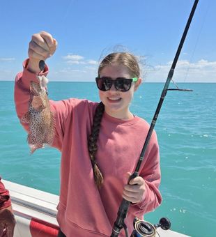 Family fishing day in the beautiful waters of the Florida Keys, making memories one catch at a time.