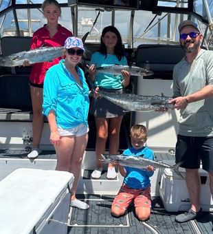 Happy king mackerel family catch