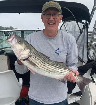 Reeled in his own trophy striper in NJ