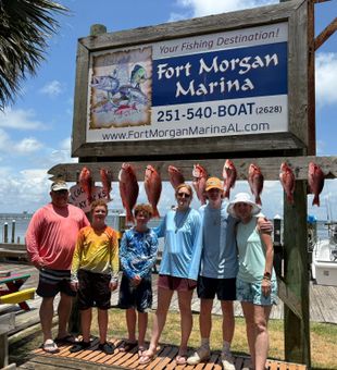 Proud family red snapper catch.