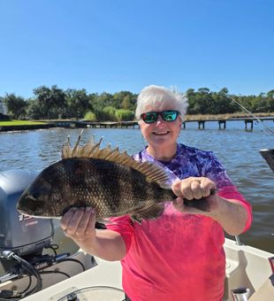 Grinning — hefty Sheepshead catch!