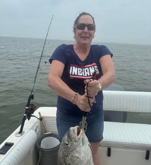 Determined grip on a hefty Black Drum.