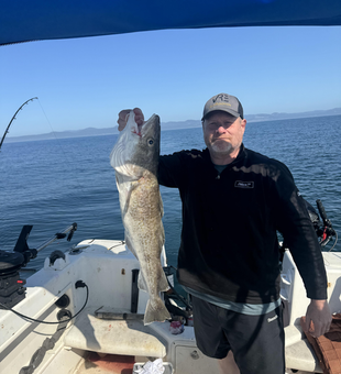Clear skies and deep sea jigging: the perfect combo for a big catch!