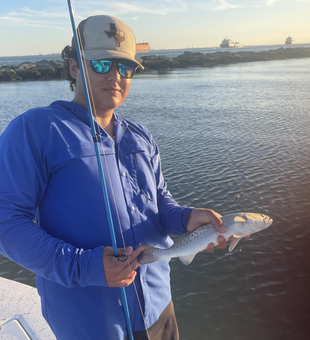 Jigging for Spotted Weakfish in Crystal Beach: A clear day's perfect catch!