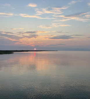 Perfect evening conditions for jigging and drift fishing. Light tackle setup ready for action.