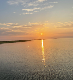 Perfect evening conditions for jigging and drift fishing at Crystal Beach. Storms possible later but great fishing weather right now.